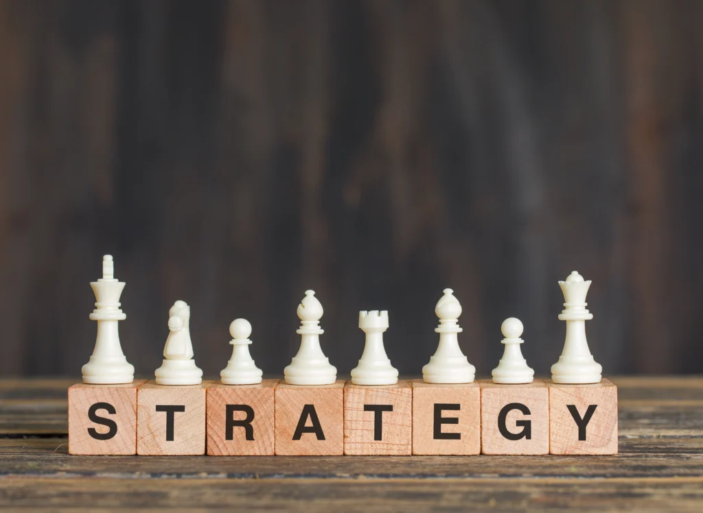 Chess Pieces on top of cubes spelling strategy 
