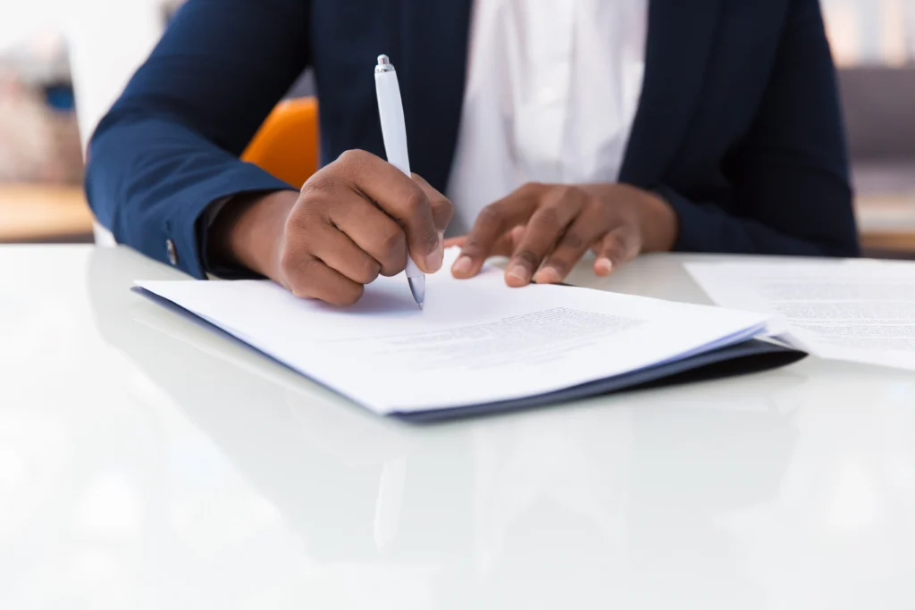 businesswoman signing contract